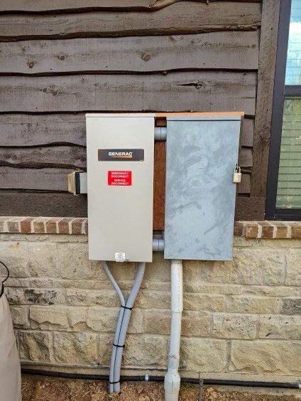 A close up of an electrical box on the side of a house.